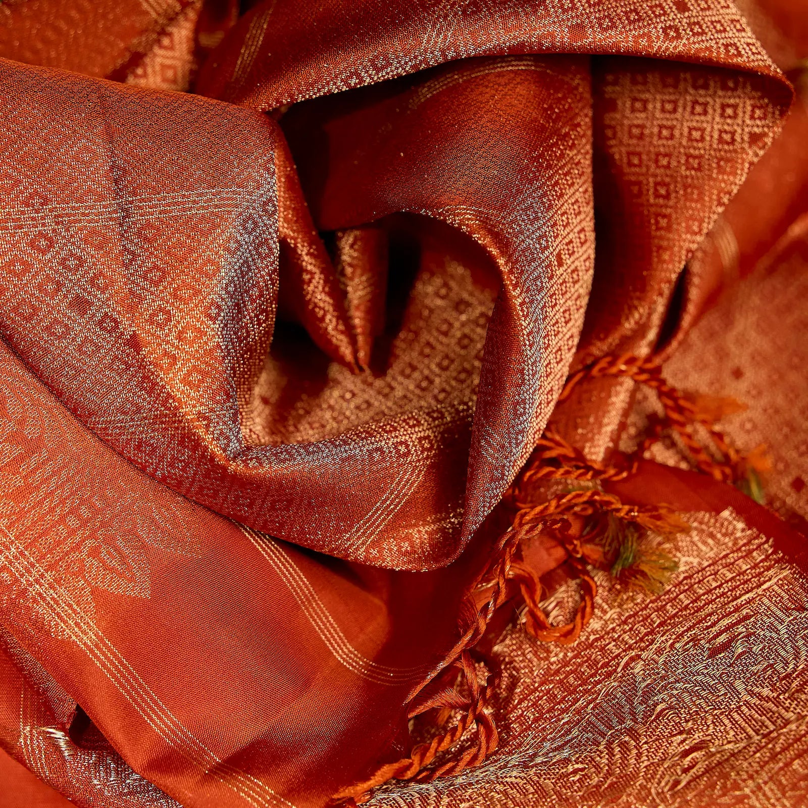Aarunya burnt orange Kanchivaram silk saree with gold zari geometric patterns and elegant tassels – festive saree UAE