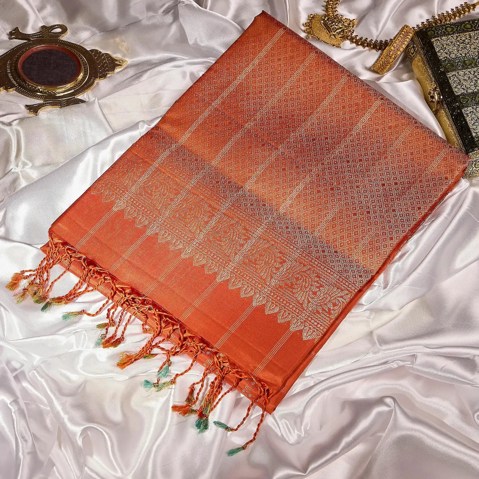 Aarunya burnt orange Kanchivaram silk saree with gold zari geometric patterns and elegant tassels – festive saree UAE