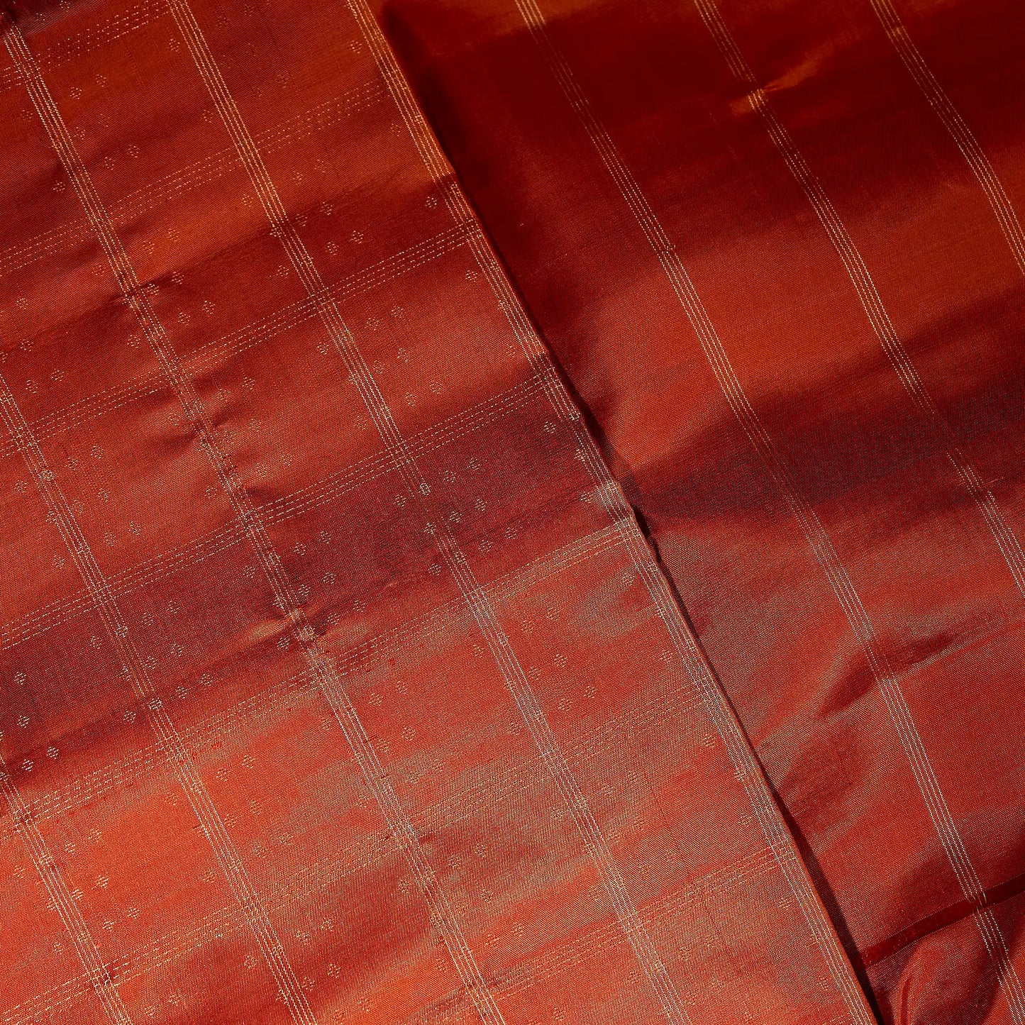 Aarunya burnt orange Kanchivaram silk saree with gold zari geometric patterns and elegant tassels – festive saree UAE