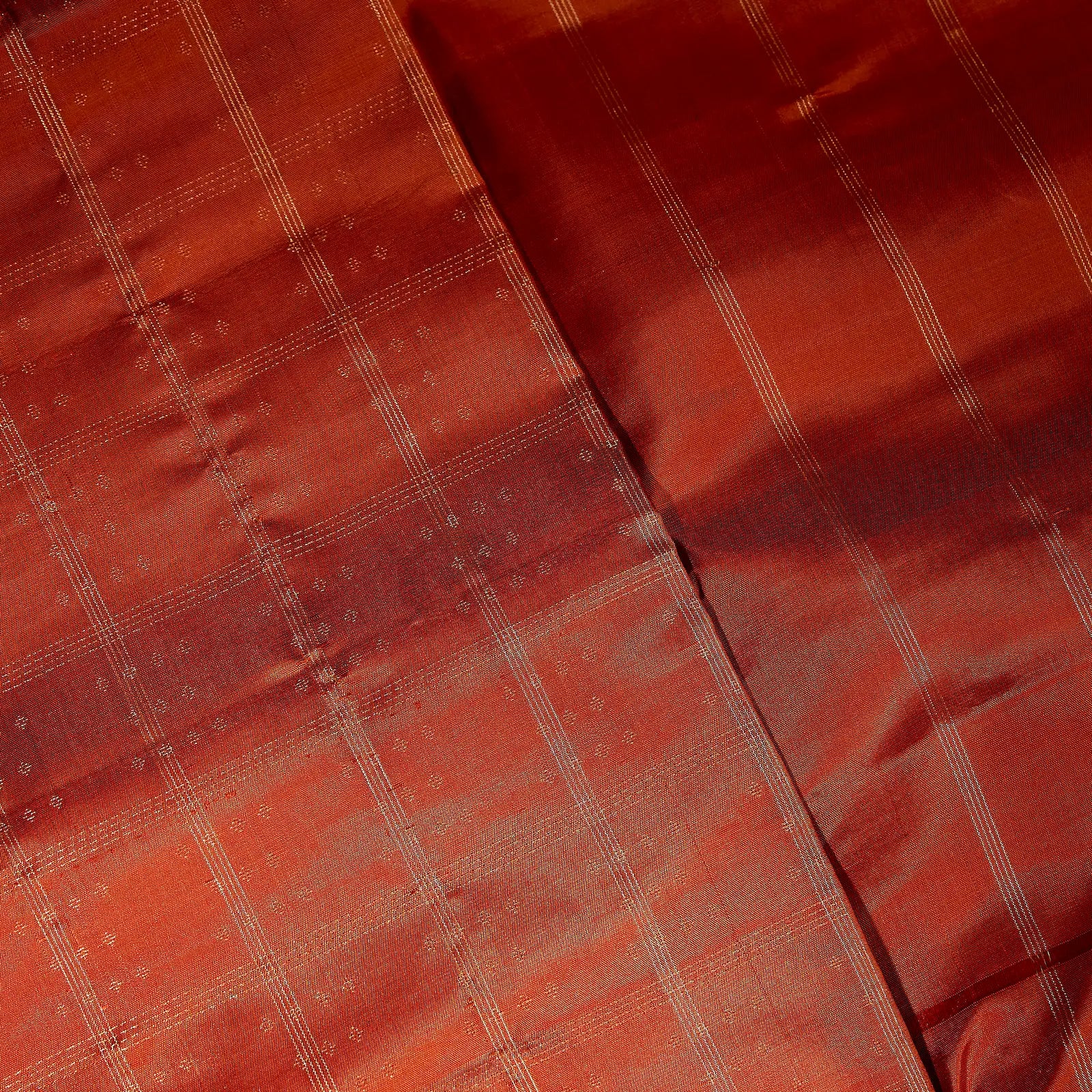Aarunya burnt orange Kanchivaram silk saree with gold zari geometric patterns and elegant tassels – festive saree UAE