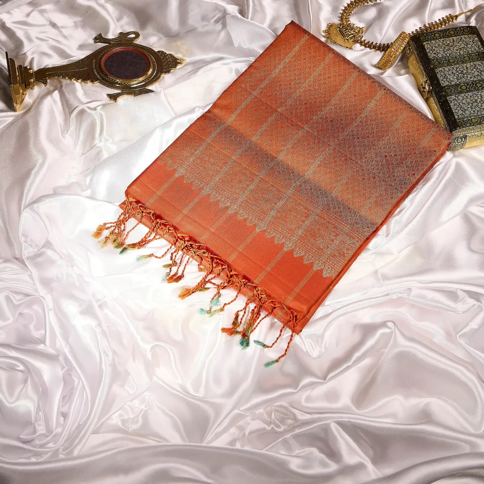 Aarunya burnt orange Kanchivaram silk saree with gold zari geometric patterns and elegant tassels – festive saree UAE