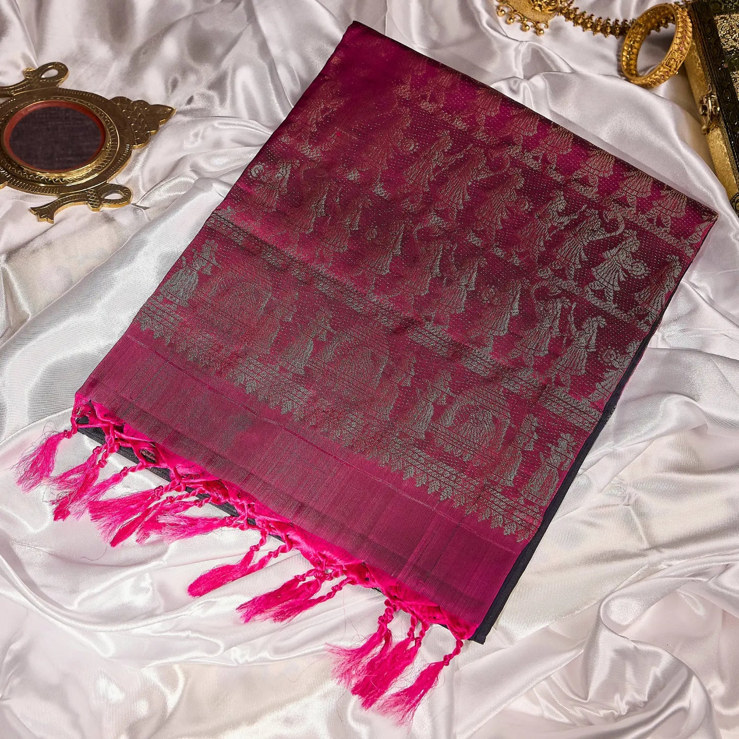 Paalki black and rani pink Kanchivaram silk saree with palanquin-inspired antique gold zari motifs and tassel detailing – bridal saree UAE