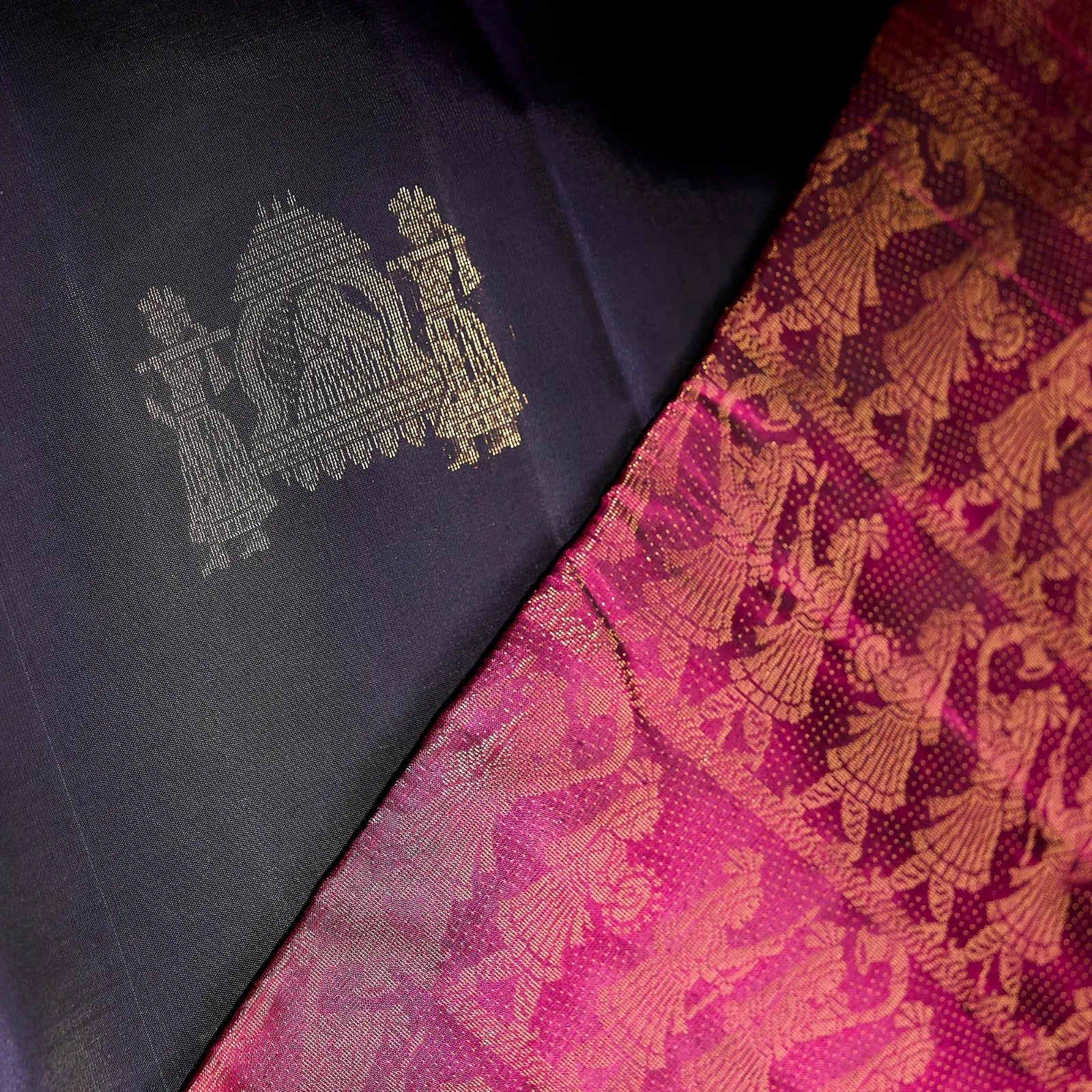 Paalki black and rani pink Kanchivaram silk saree with palanquin-inspired antique gold zari motifs and tassel detailing – bridal saree UAE