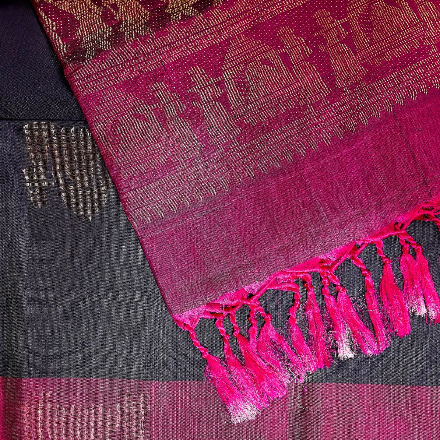 Paalki black and rani pink Kanchivaram silk saree with palanquin-inspired antique gold zari motifs and tassel detailing – bridal saree UAE