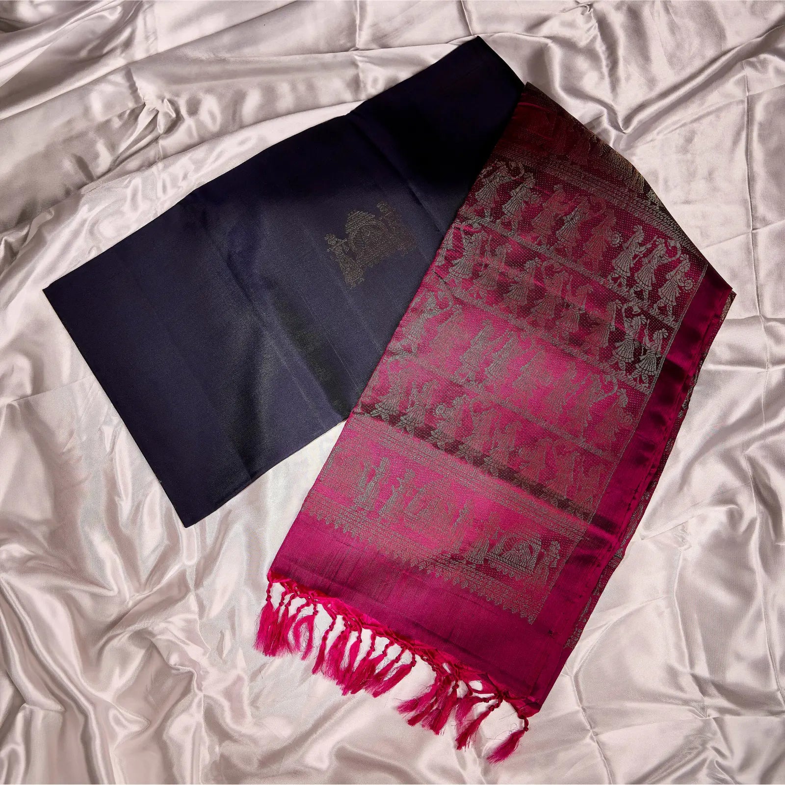 Paalki black and rani pink Kanchivaram silk saree with palanquin-inspired antique gold zari motifs and tassel detailing – bridal saree UAE