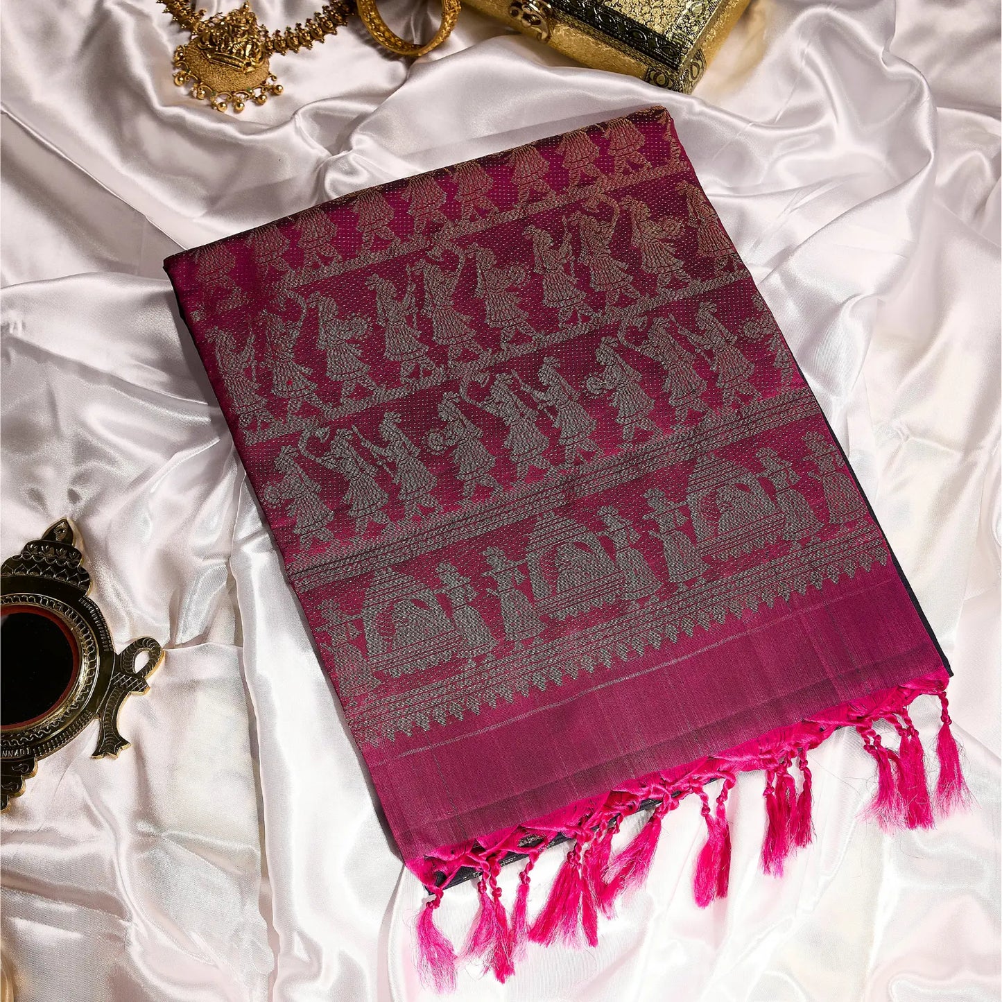 Paalki black and rani pink Kanchivaram silk saree with palanquin-inspired antique gold zari motifs and tassel detailing – bridal saree UAE
