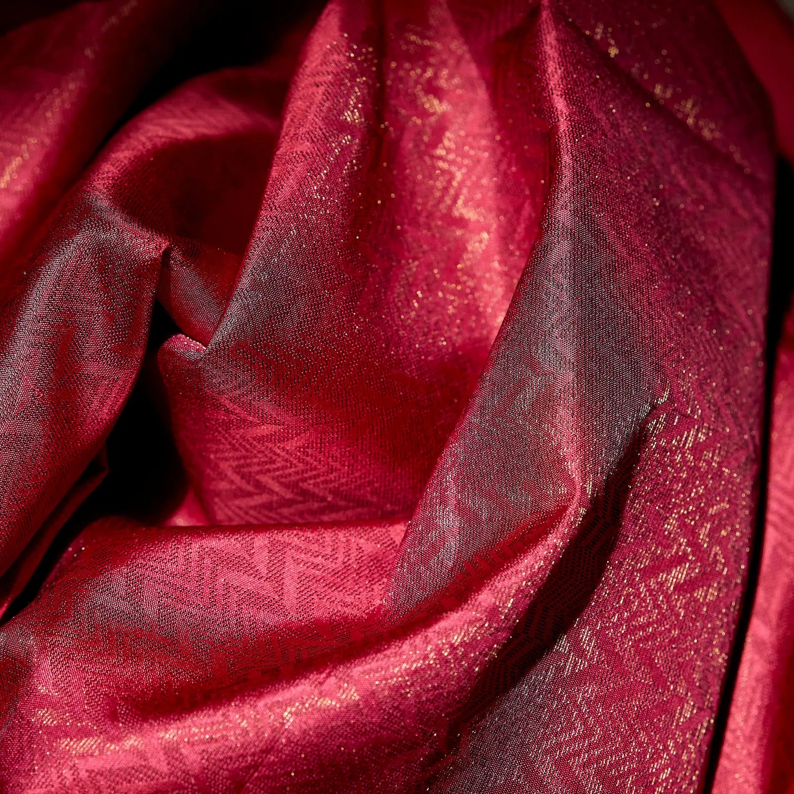 Roshivya deep rose pink Kanchivaram silk saree with chevron weave texture and subtle gold zari detailing – festive saree UAE