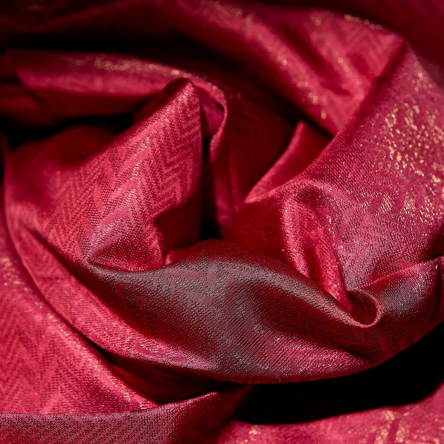 Roshivya deep rose pink Kanchivaram silk saree with chevron weave texture and subtle gold zari detailing – festive saree UAE