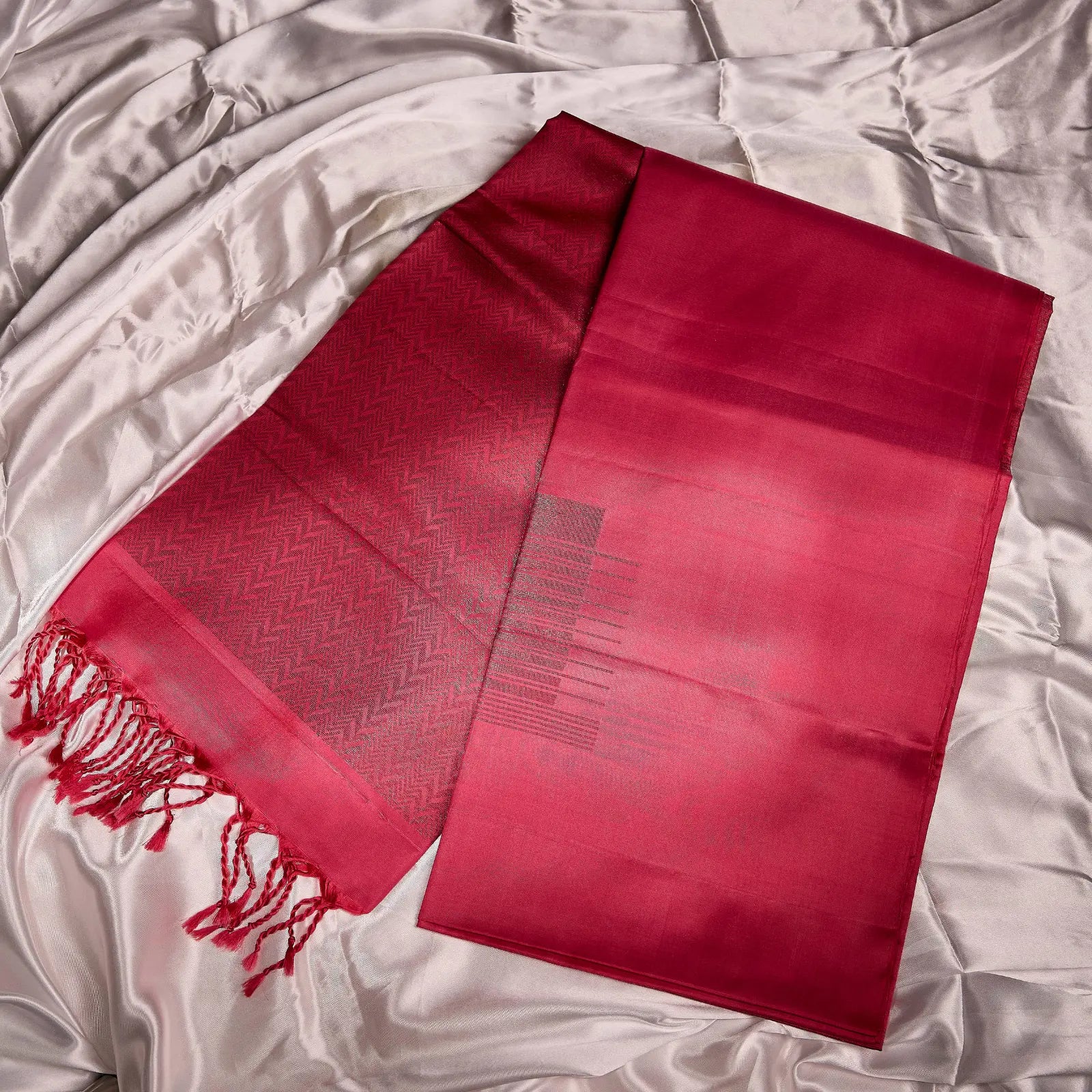 Roshivya deep rose pink Kanchivaram silk saree with chevron weave texture and subtle gold zari detailing – festive saree UAE