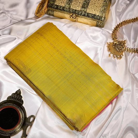 Kanaka Rani mustard gold and ruby pink Kanchivaram silk saree with fine zari motifs and contrast pallu – Ethereal Weaves UAE
 