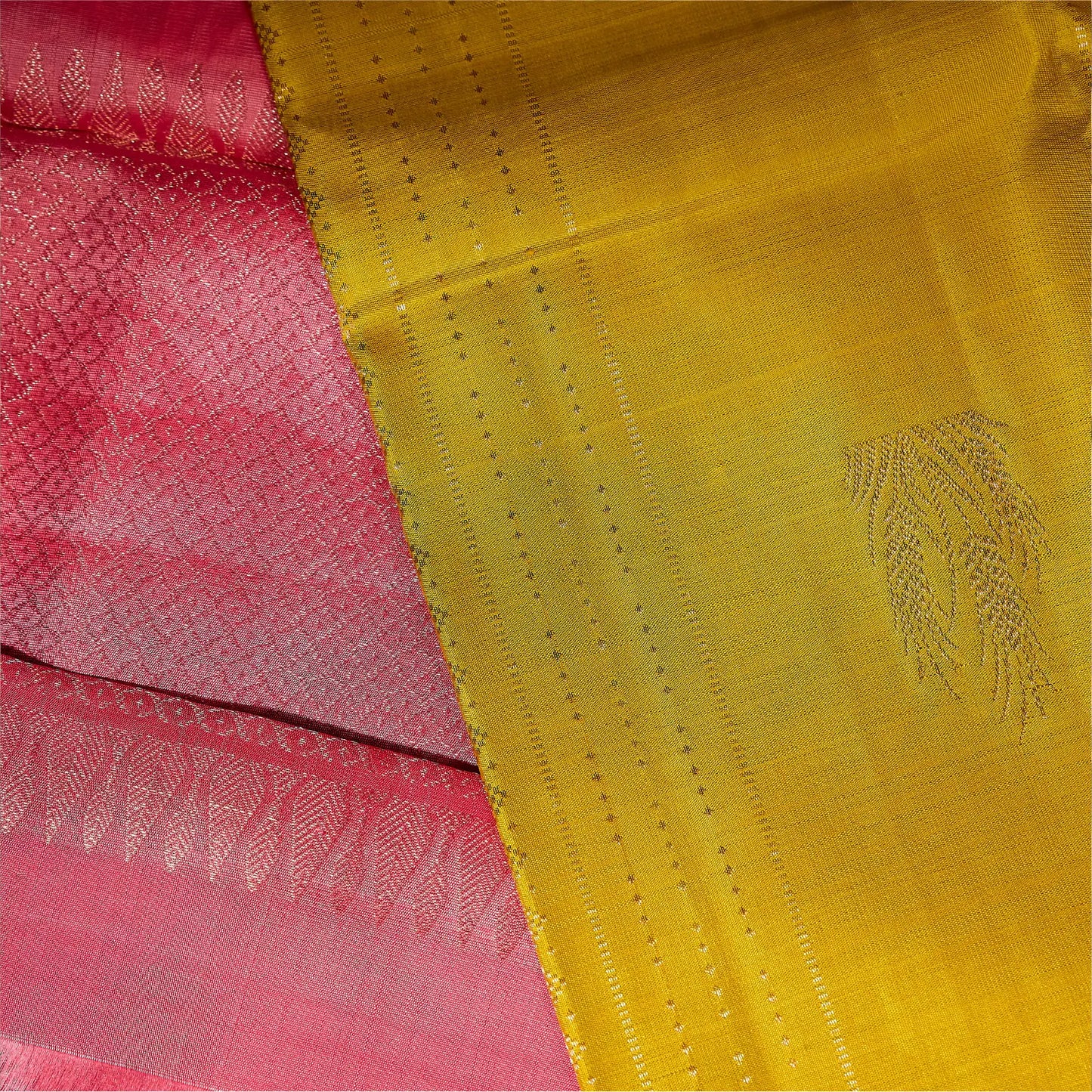 Kanaka Rani mustard gold and ruby pink Kanchivaram silk saree with fine zari motifs and contrast pallu – Ethereal Weaves UAE.
