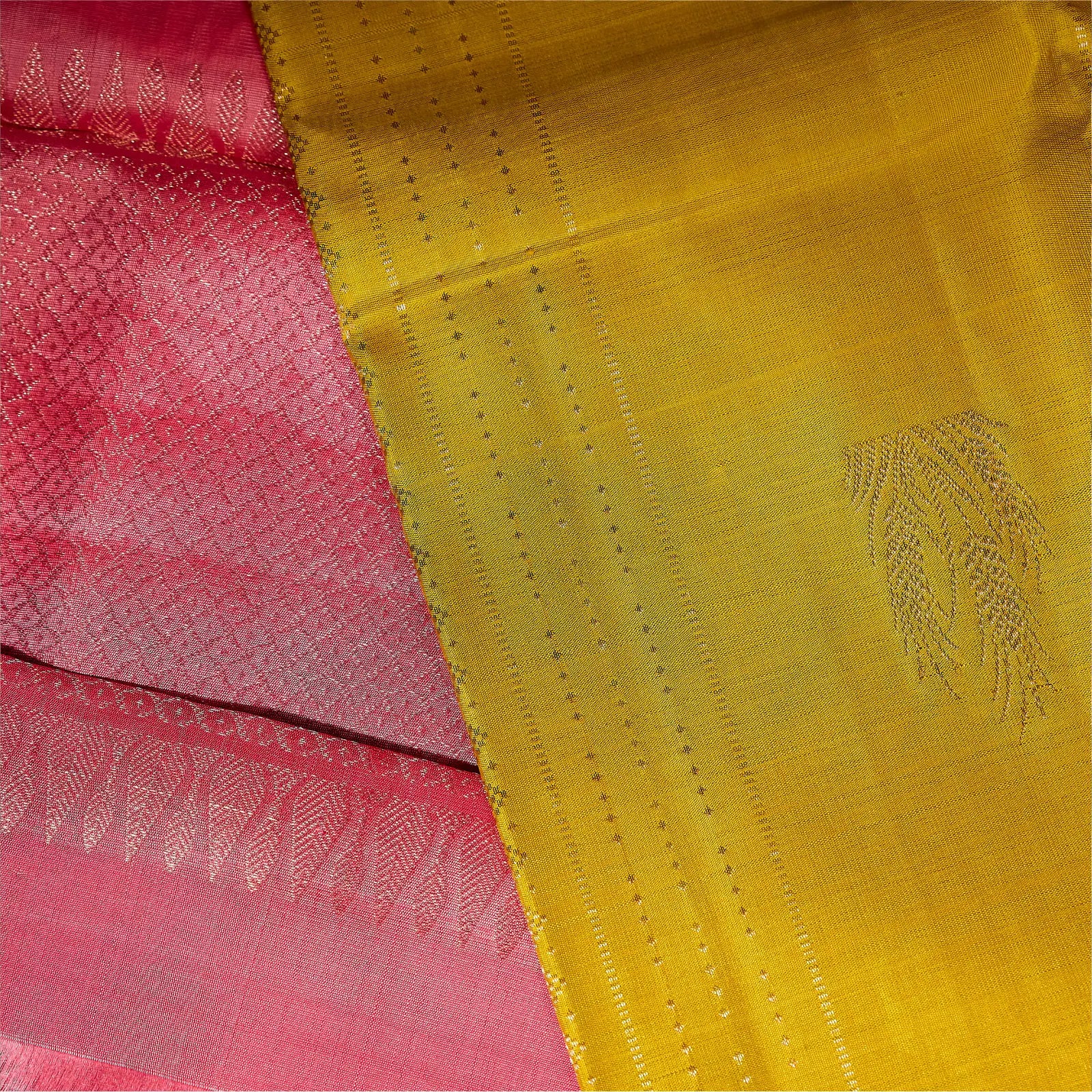 Kanaka Rani mustard gold and ruby pink Kanchivaram silk saree with fine zari motifs and contrast pallu – Ethereal Weaves UAE.