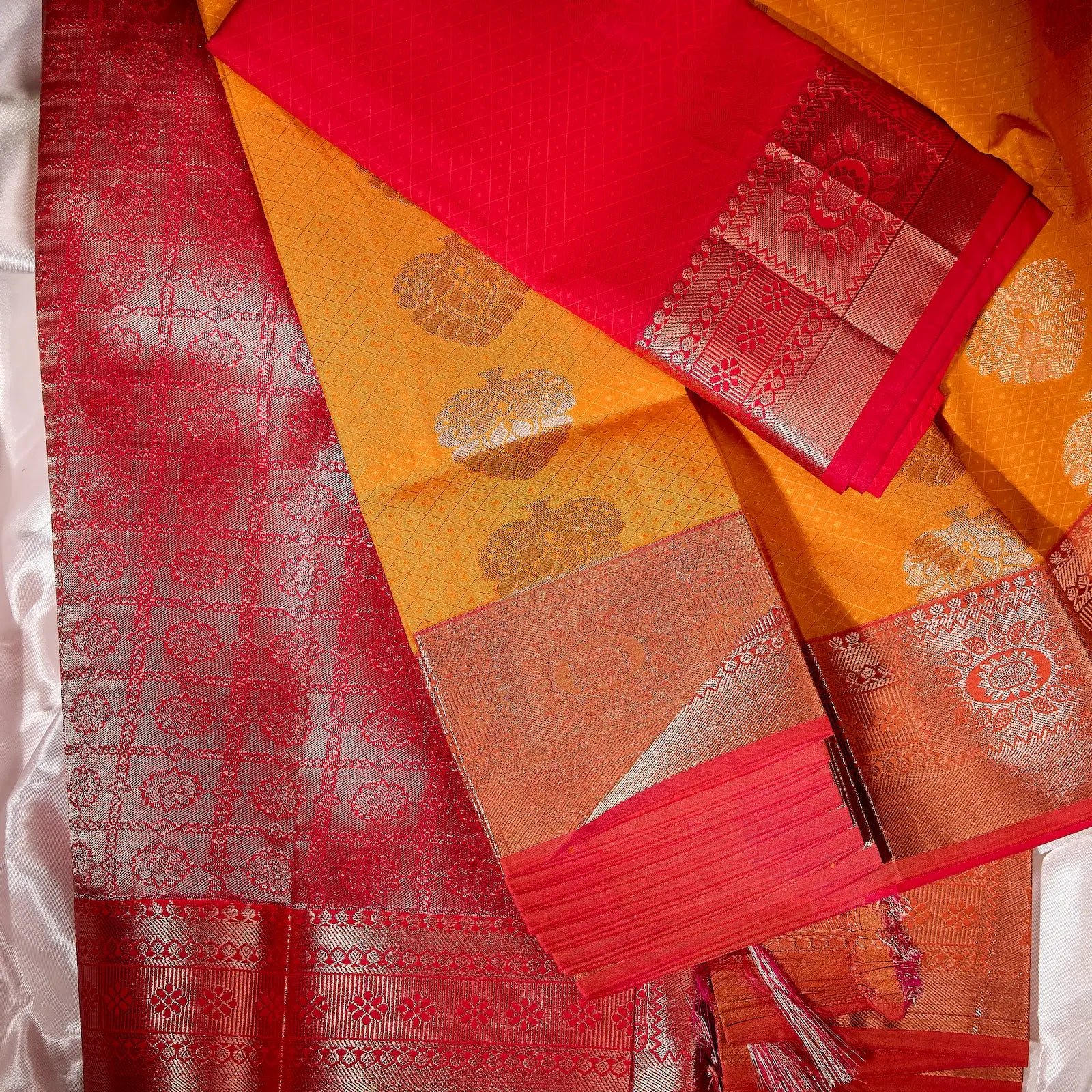 Kesari Varnika amber gold and rani pink Kanchivaram silk saree with floral zari motifs and tassel accents – festive saree UAE