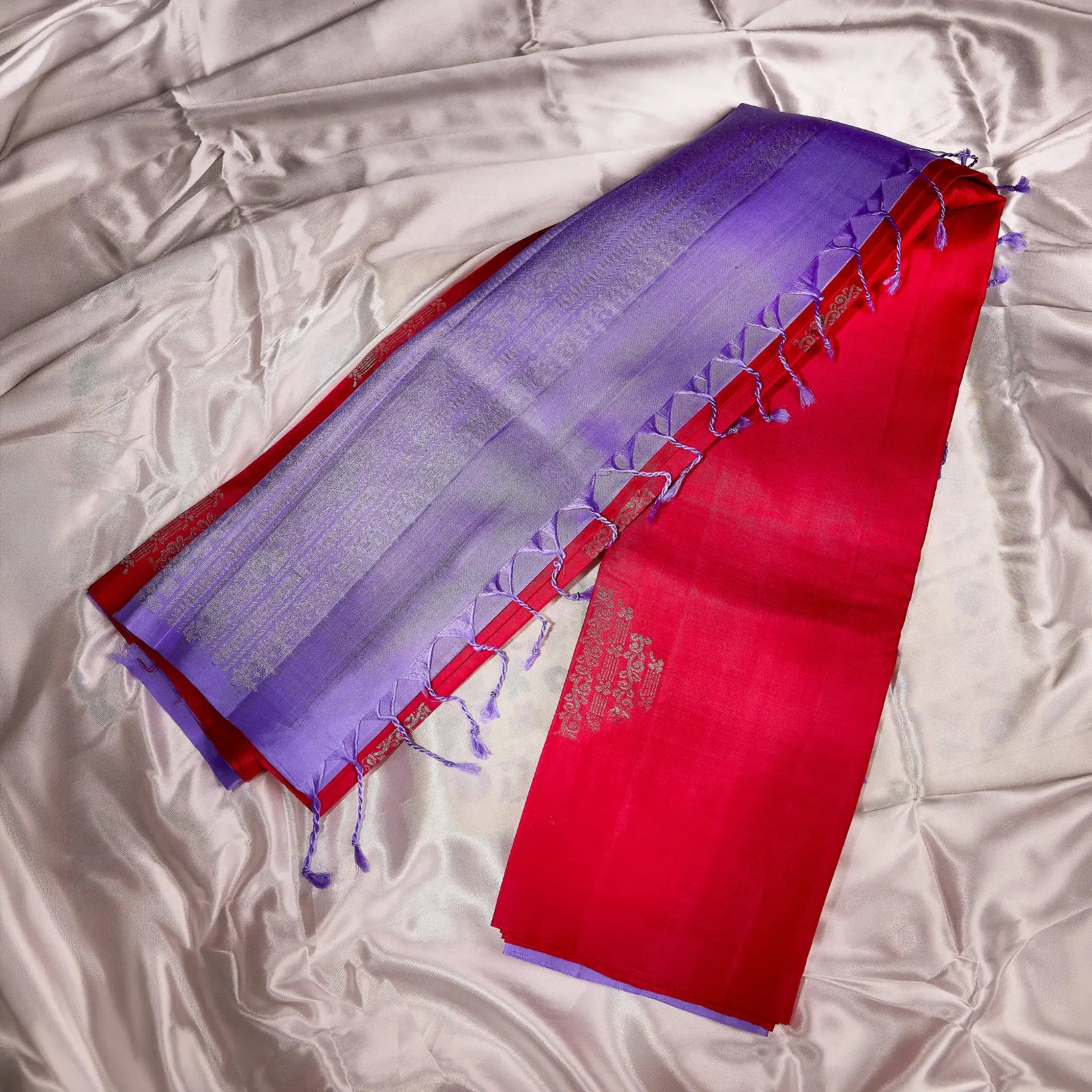 Lilac Lavanya lavender purple and ruby red Kanchivaram silk saree with silver zari and tassel detailing – Ethereal Weaves UAE.