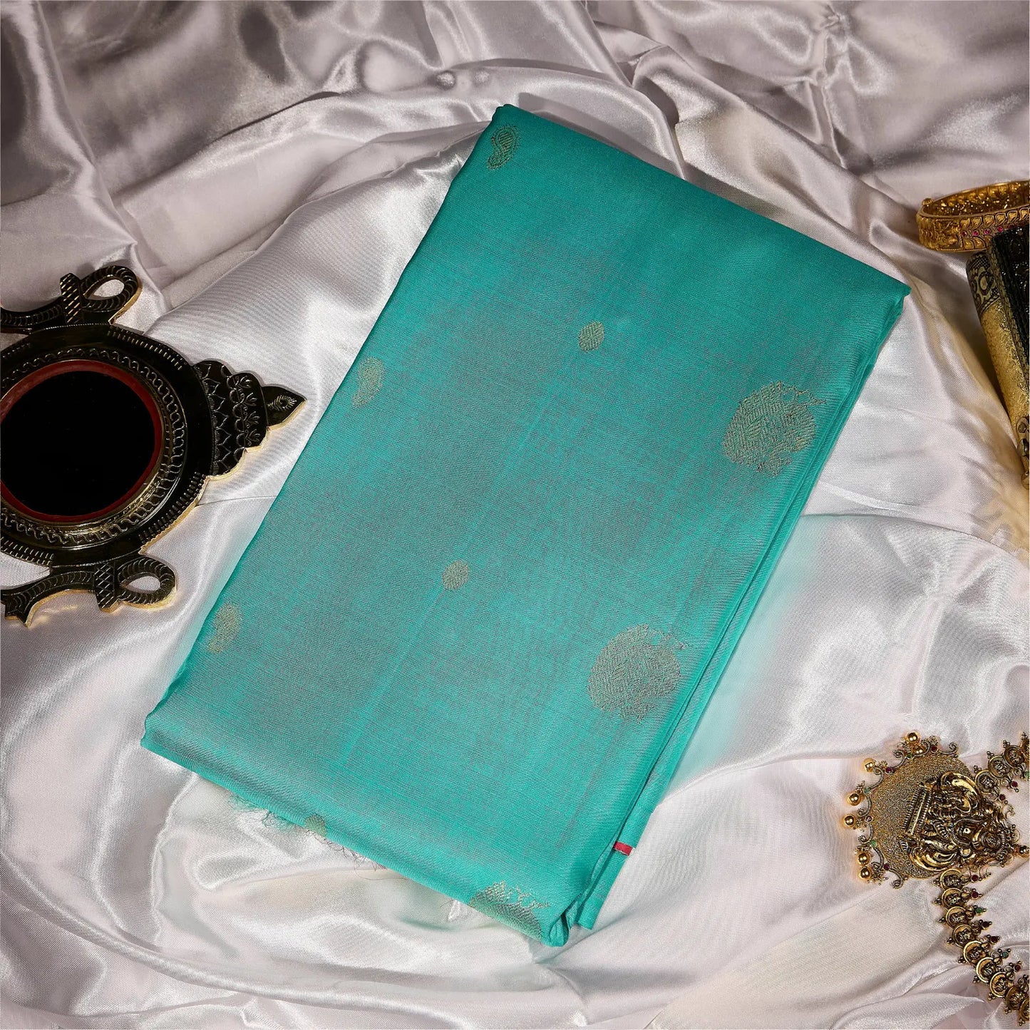 Mehera aqua blue Kanchivaram silk saree with rani pink contrast pallu and gold zari motifs – Ethereal Weaves UAE.