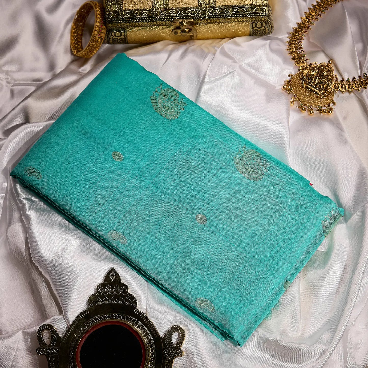 Mehera aqua blue Kanchivaram silk saree with rani pink contrast pallu and gold zari motifs – Ethereal Weaves UAE.