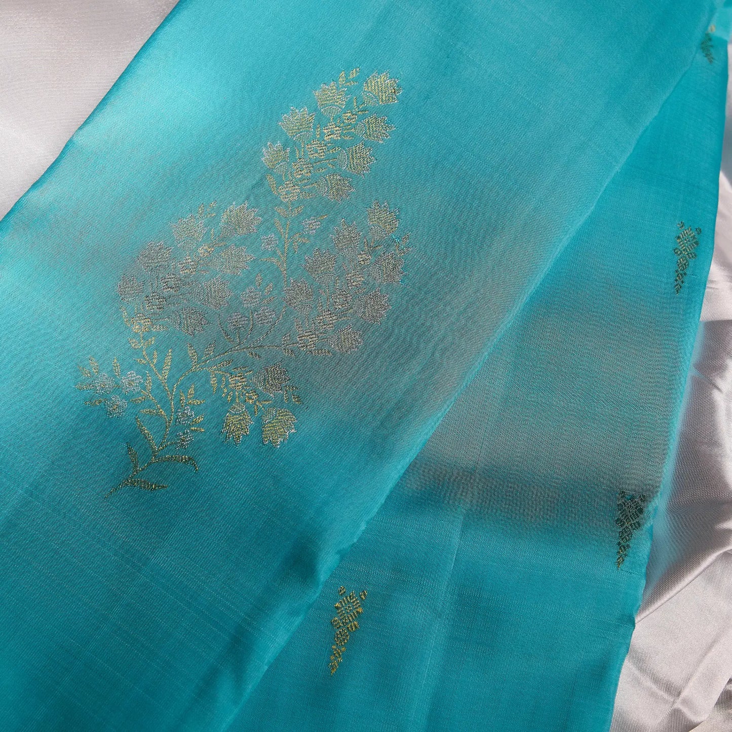 Neelambari Veda aqua blue Kanchivaram silk saree with elegant silver floral zari motifs and soft lustrous sheen – festive saree UAE