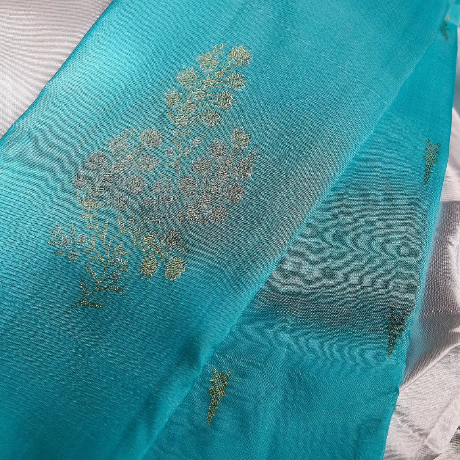 Neelambari Veda aqua blue Kanchivaram silk saree with elegant silver floral zari motifs and soft lustrous sheen – festive saree UAE