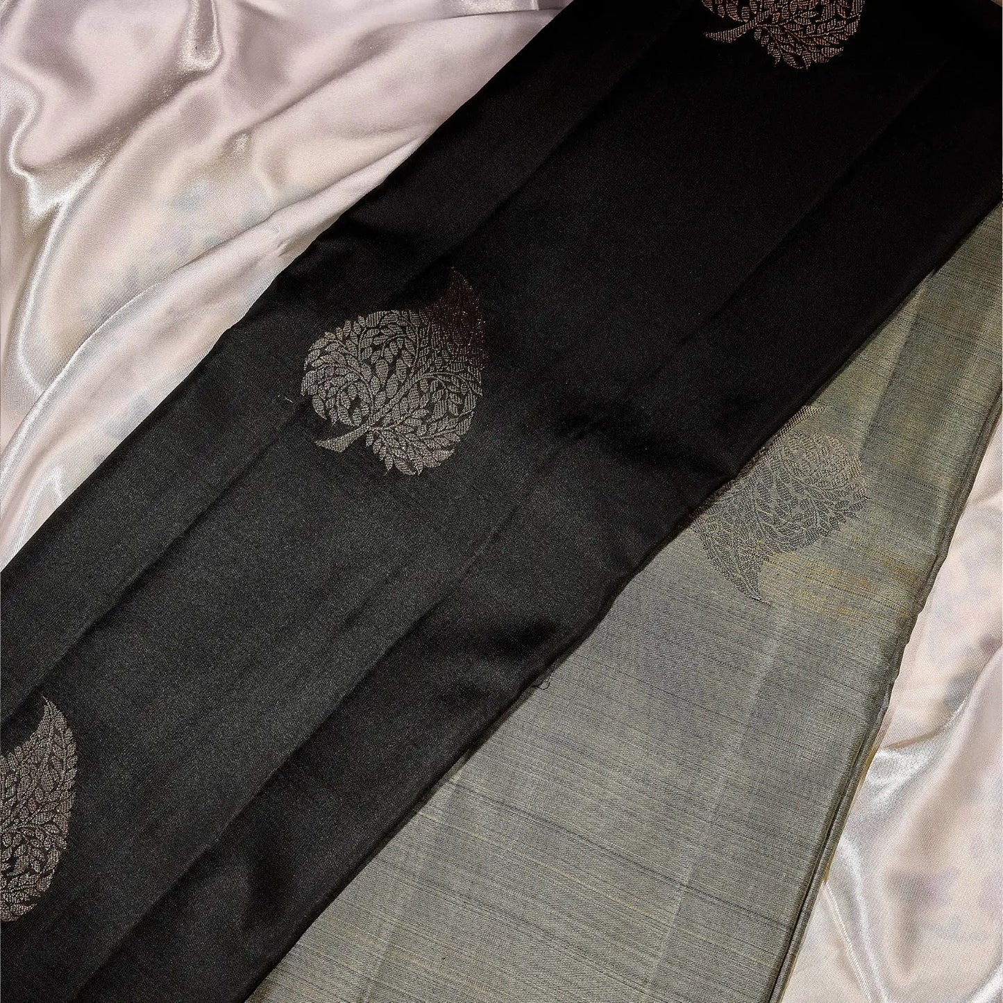 Noir Vasantham classic black Kanchivaram silk saree with antique gold zari geometric border and leaf motif pallu – Ethereal Weaves UAE

