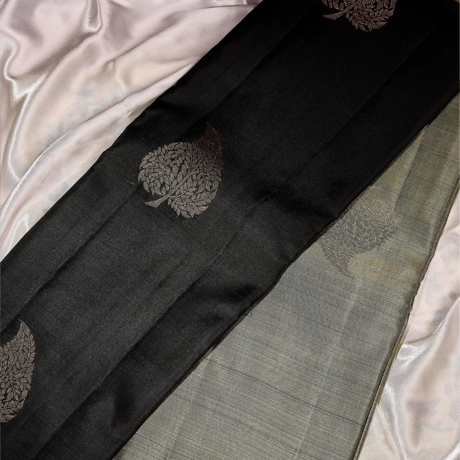 Noir Vasantham classic black Kanchivaram silk saree with antique gold zari geometric border and leaf motif pallu – Ethereal Weaves UAE
