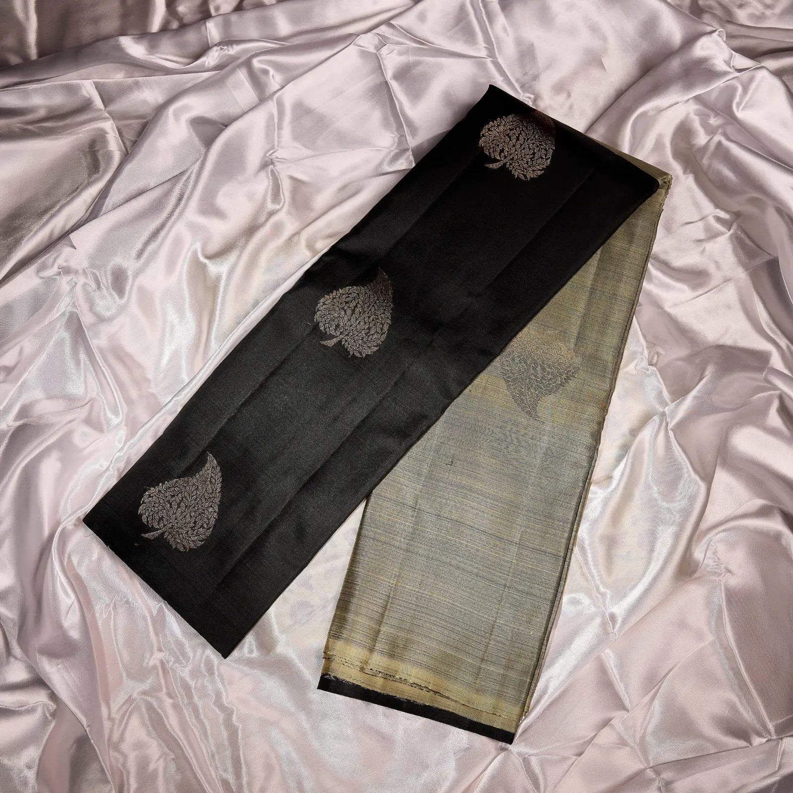 Noir Vasantham classic black Kanchivaram silk saree with antique gold zari geometric border and leaf motif pallu – Ethereal Weaves UAE

