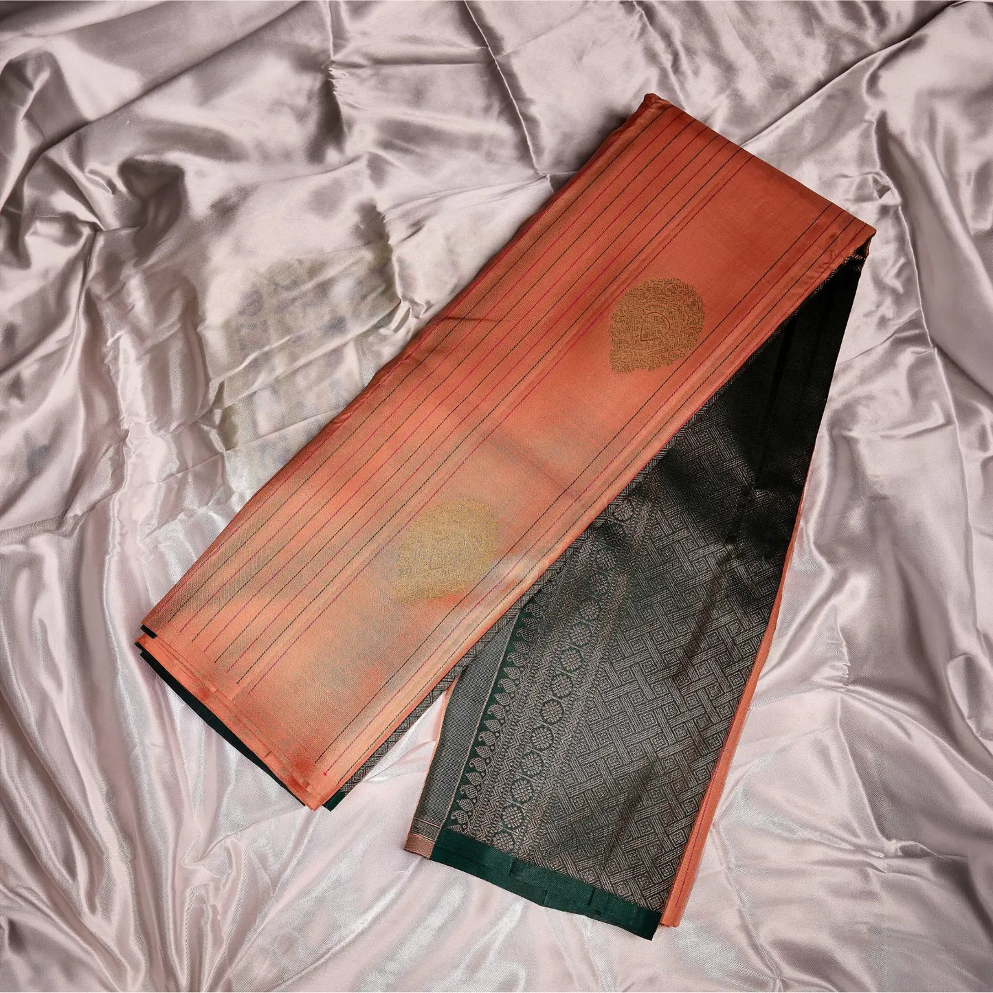 Pehrika peach Kanchivaram silk saree with gold zari stripes and copper-tinted bottle green contrast pallu – festive saree UAE